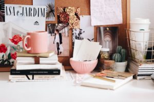 charming office desk with pinboard and flowers