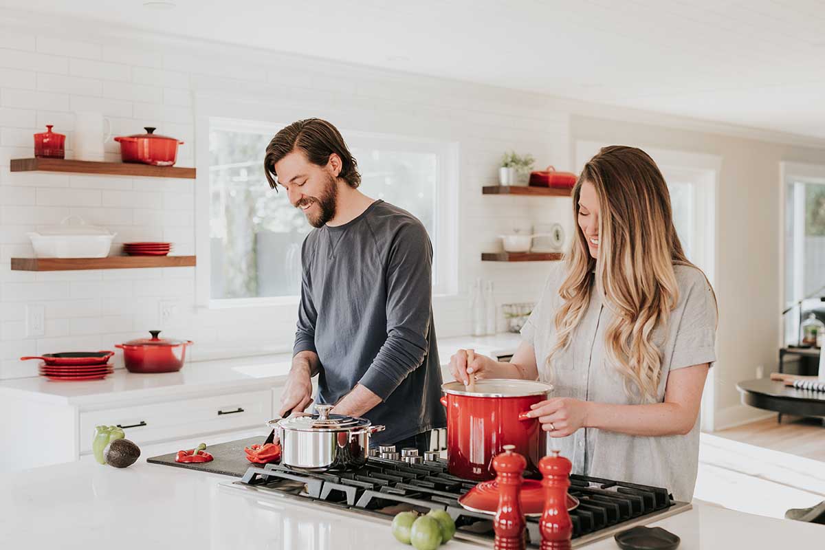 couple cooking in kitchen